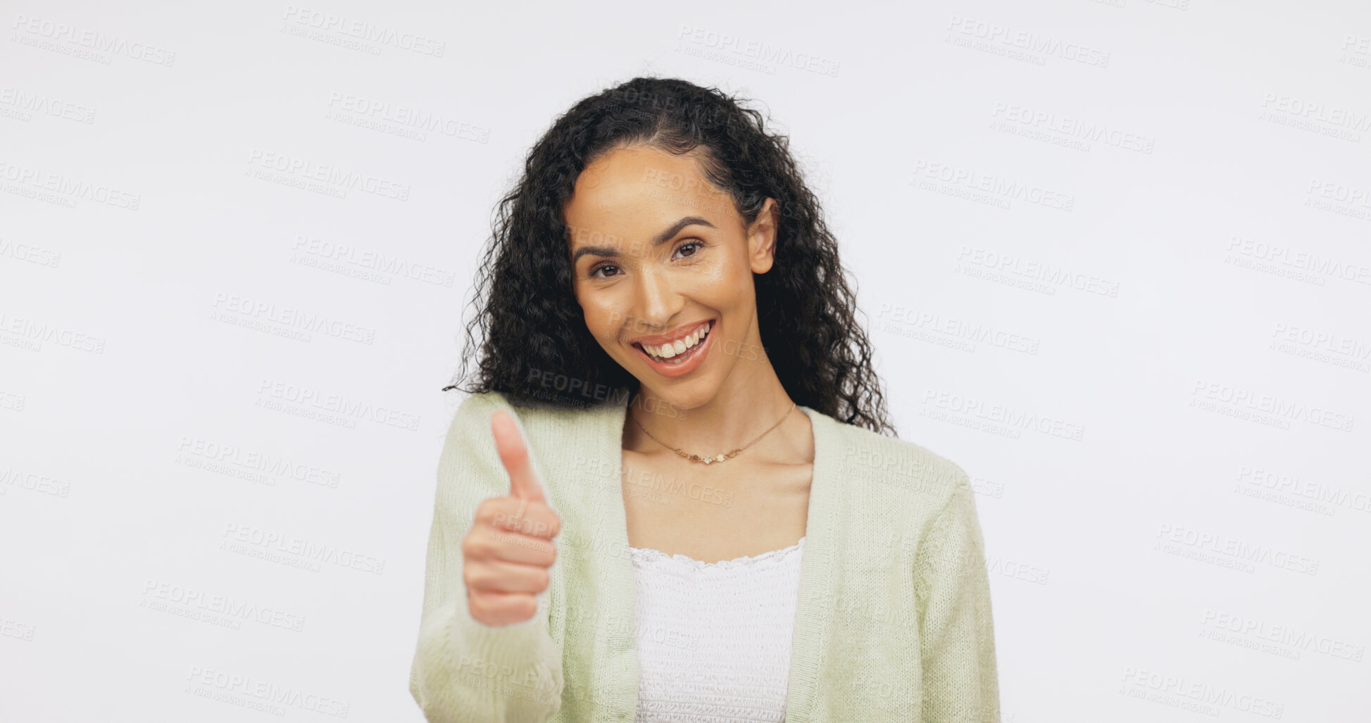 Buy stock photo Portrait, vote and happy woman with thumb up in studio, knowledge or positive opinion for university. White background, promotion and person with agreement sign, mockup space and education in Brazil