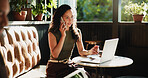 Woman, phone call and laptop in coffee shop for remote work, trend research and conversation. Freelance person, tech and chat in cafe for project, communication or social networking in small business