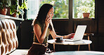 Woman, laptop and cafe with phone call for discussion, communication or conversation. Female person, freelancer or journalist talking with mobile smartphone, app or computer for chat in coffee shop