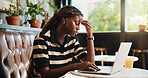 Black woman, headache and laptop with stress in cafe for mistake, fatigue or mental health. Frustrated, female person or freelancer with migraine, pain or ache on computer for deadline in coffee shop