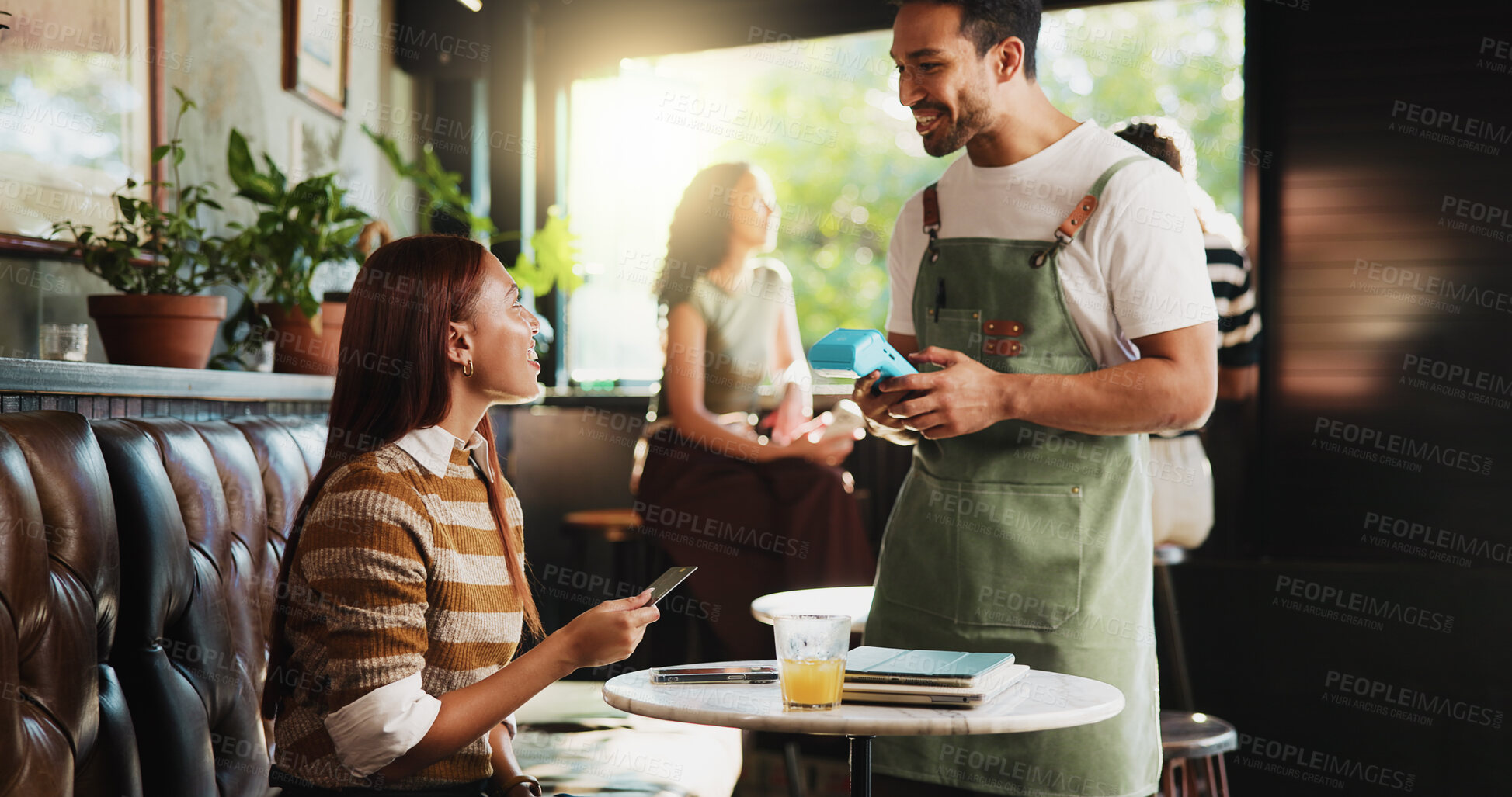 Buy stock photo Woman, credit card and waiter with pos at coffee shop, order and happy customer experience at diner. People, server and smile with easy payment at cafe, fintech or machine with thanks at restaurant