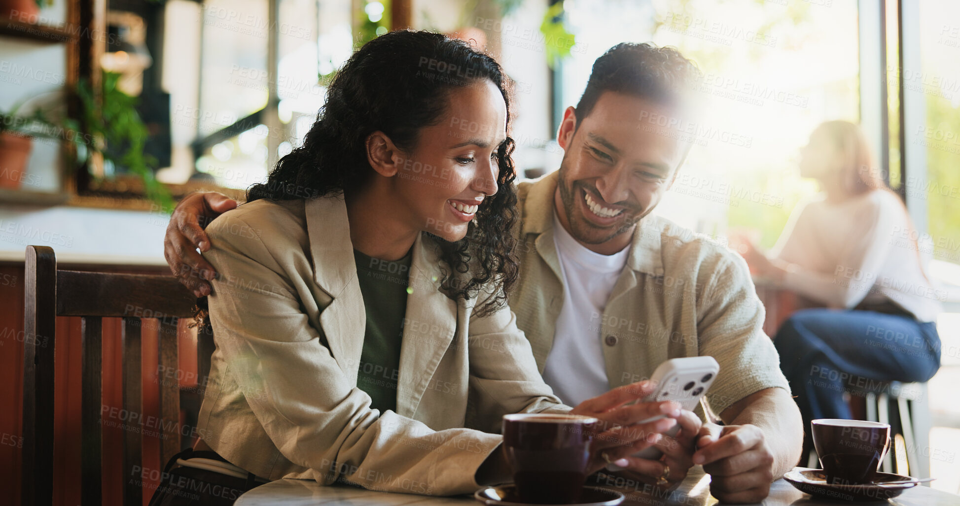 Buy stock photo Coffee, phone and couple in cafe on date with social media, texting or funny blog on mobile app. Laughing, warm beverage and man with woman on cellphone for comic meme online in restaurant or diner.