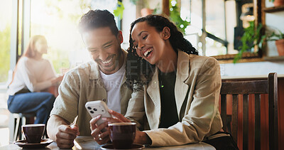 Buy stock photo Coffee, laugh and couple with phone in cafe on date with social media, texting or funny blog on app. Happy, warm beverage and man with woman on cellphone for comic meme online in restaurant or diner.