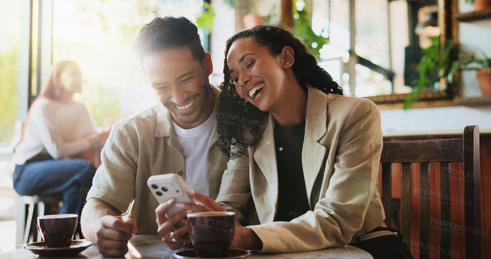 Buy stock photo Coffee, laugh and couple with phone in cafe on date with social media, texting or funny blog on app. Happy, warm beverage and man with woman on cellphone for comic meme online in restaurant or diner.