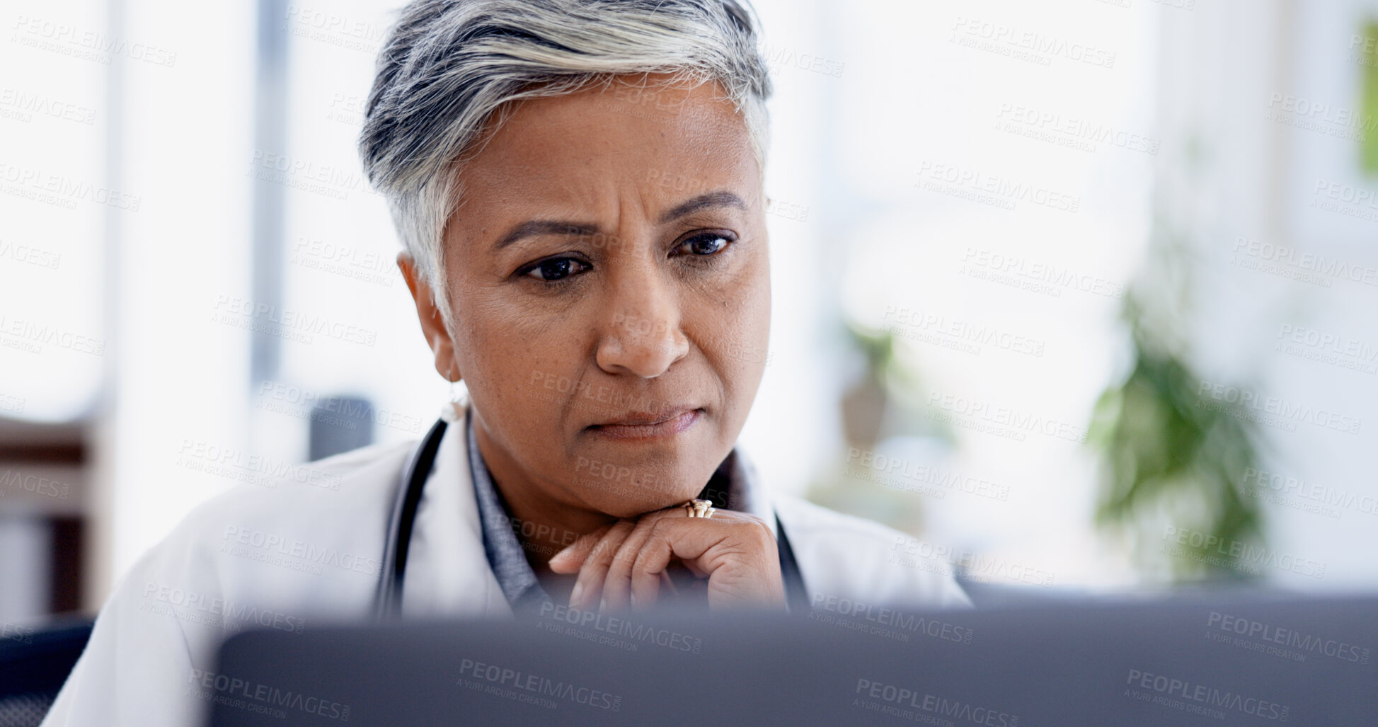 Buy stock photo Doctor, thinking and laptop with woman in office for planning, healthcare vision and telehealth query. Medical questionnaire, reflection and treatment idea with mature person in clinic for feedback