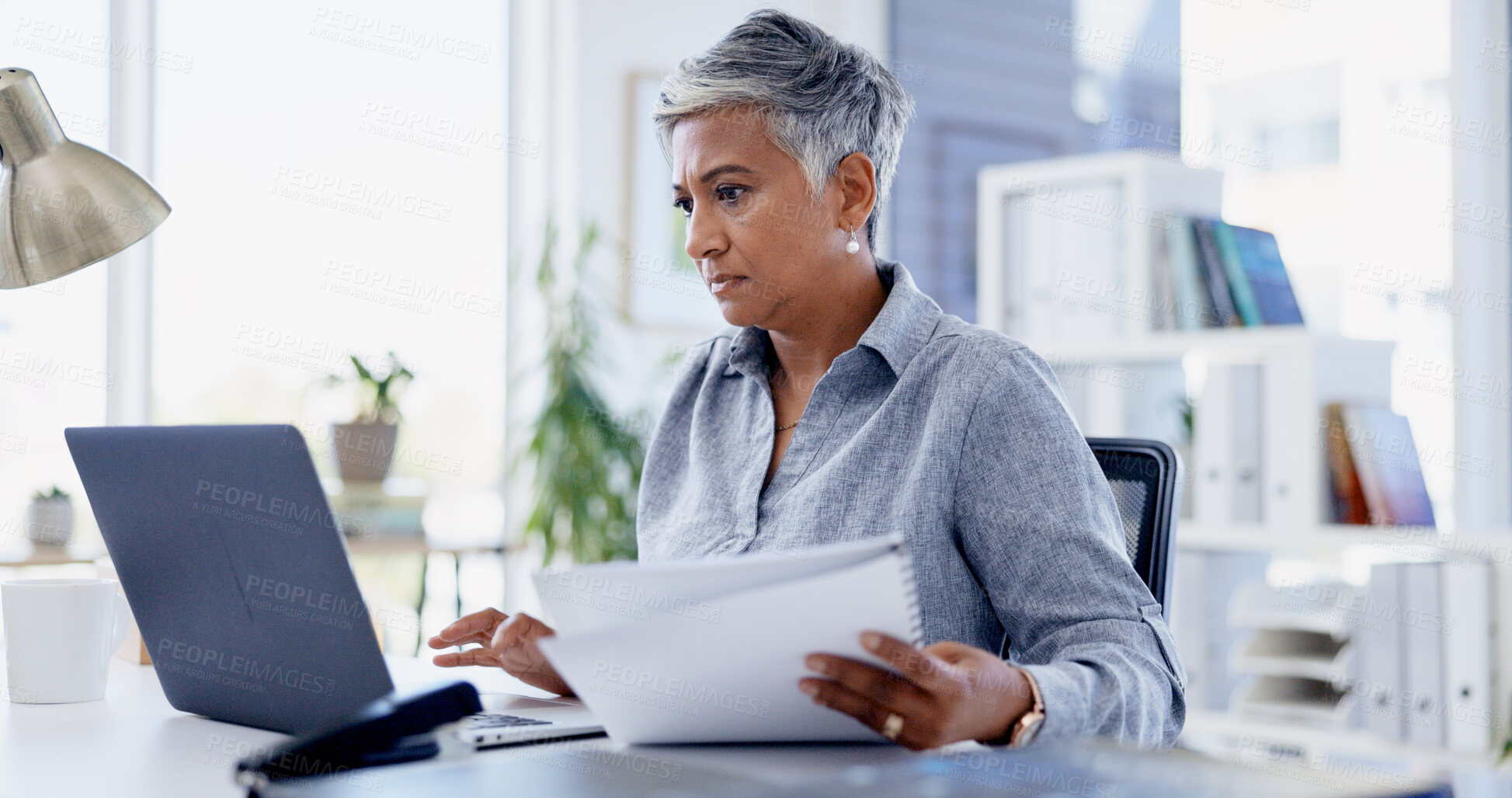 Buy stock photo Documents, laptop and businesswoman in office for deal, legal contract or agreement. Research, computer and mature female attorney with paperwork for application form with title deed in workplace.