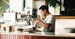 Man, barista or milk with coffee machine in cafe for caffeine brewery, order or customer service. Male person, espresso chef or latte artist crafting with coffeemaker in shop or store for hospitality