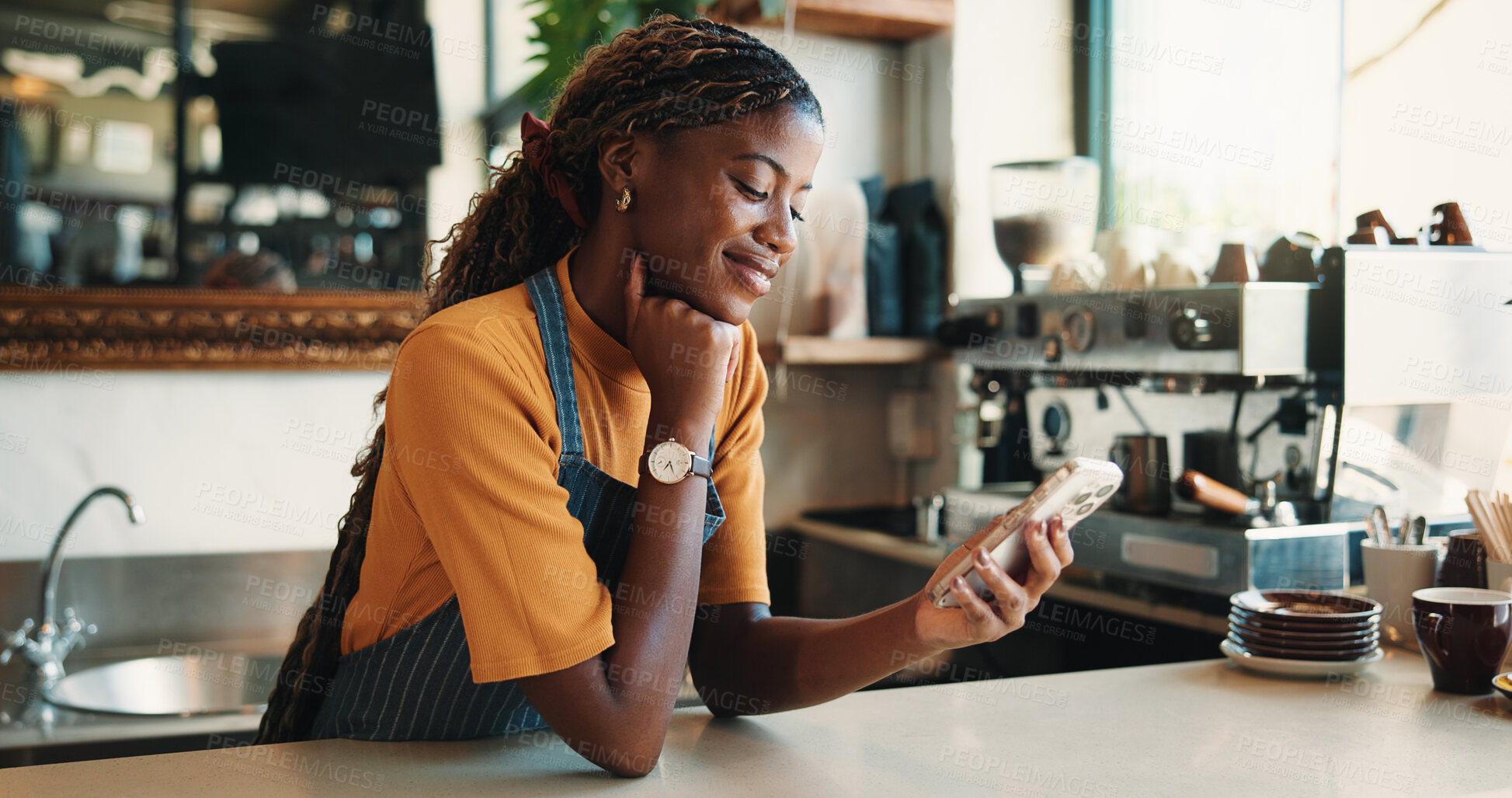 Buy stock photo Text, reading and barista in cafe with phone, chat or social media update on work break. Message, digital or black woman in restaurant with tech, business review or online communication in free time.