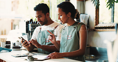 Buy stock photo Business people, phone and inventory with checklist in cafe for stock control or online order. Man, woman or employees with smartphone or clipboard in coffee shop for revenue, finance or analysis