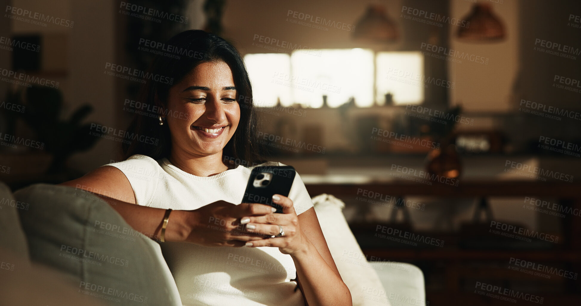 Buy stock photo Happy, reading and phone with woman on sofa in home for communication, social media and relax. Contact, online chat and connection with person and mobile in living room of apartment for app and post