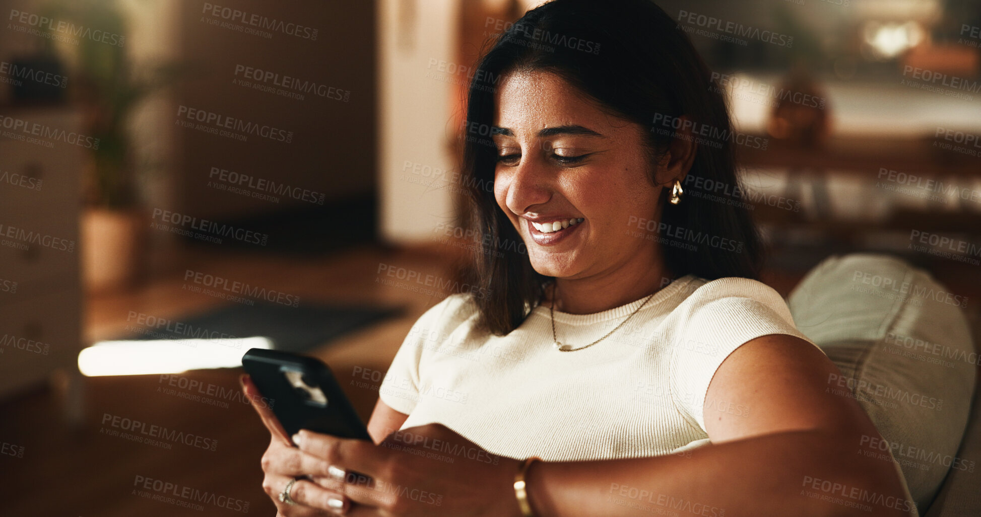 Buy stock photo Smile, text message and phone with woman on sofa in home for communication, social media and relax. Contact, online chat and connection with person and mobile in living room of apartment for app