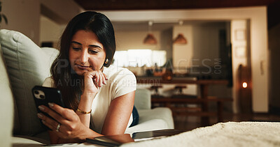 Buy stock photo Phone, relax and reading with woman on sofa in home for communication, social media and contact. Virtual chat, connection and networking app with person in apartment for news, update and post