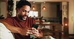 Smile, reading and phone with man on sofa in home for communication, social media and relax. Contact, online chat and connection with person and mobile in living room of apartment for app and post