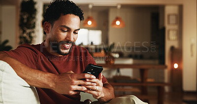 Buy stock photo Smile, reading and phone with man on sofa in home for communication, social media and relax. Contact, online chat and connection with person and mobile in living room of apartment for app and post