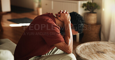 Buy stock photo Sad, thinking and man with depression, anxiety and remember memories of sorrow alone in living room. Frustrated, reflection and person with mental health, stress and contemplation for regret in home.