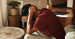 Sad, thinking and man with depression, mental health and remember memories of sorrow alone in lounge. Frustrated, reflection and upset person with anxiety, stress or overwhelmed with regret in house.