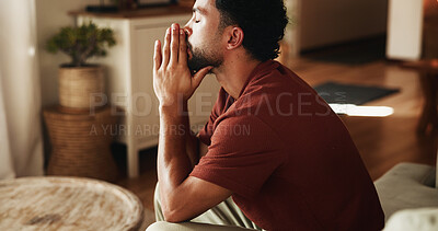 Buy stock photo Stress, thinking and man with depression, anxiety and remember memories of sorrow alone in lounge. Frustrated, reflection and person with mental health, despair and contemplation for regret in house.