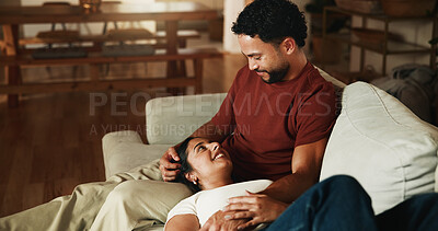 Buy stock photo Happy, couple and relax on sofa with love, romantic connection and bonding together on weekend break. People, smile and rest in home with marriage commitment, loyalty and care for partner in lounge.