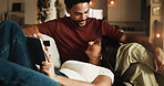 Couple, relax and credit card on sofa with tablet, digital payment or online shopping for anniversary. Happy, people and internet banking in home with tech, love and purchase for marriage commitment.