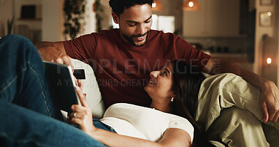 Buy stock photo Couple, relax and credit card on sofa with tablet, digital payment or online shopping for anniversary. Happy, people and internet banking in home with tech, love and purchase for marriage commitment.