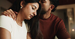Kiss, couple and upset woman in home, post conflict reconciliation and affection for partner apology. Support, frustrated and people with sorry for relationship tension, unhappy or dispute resolution