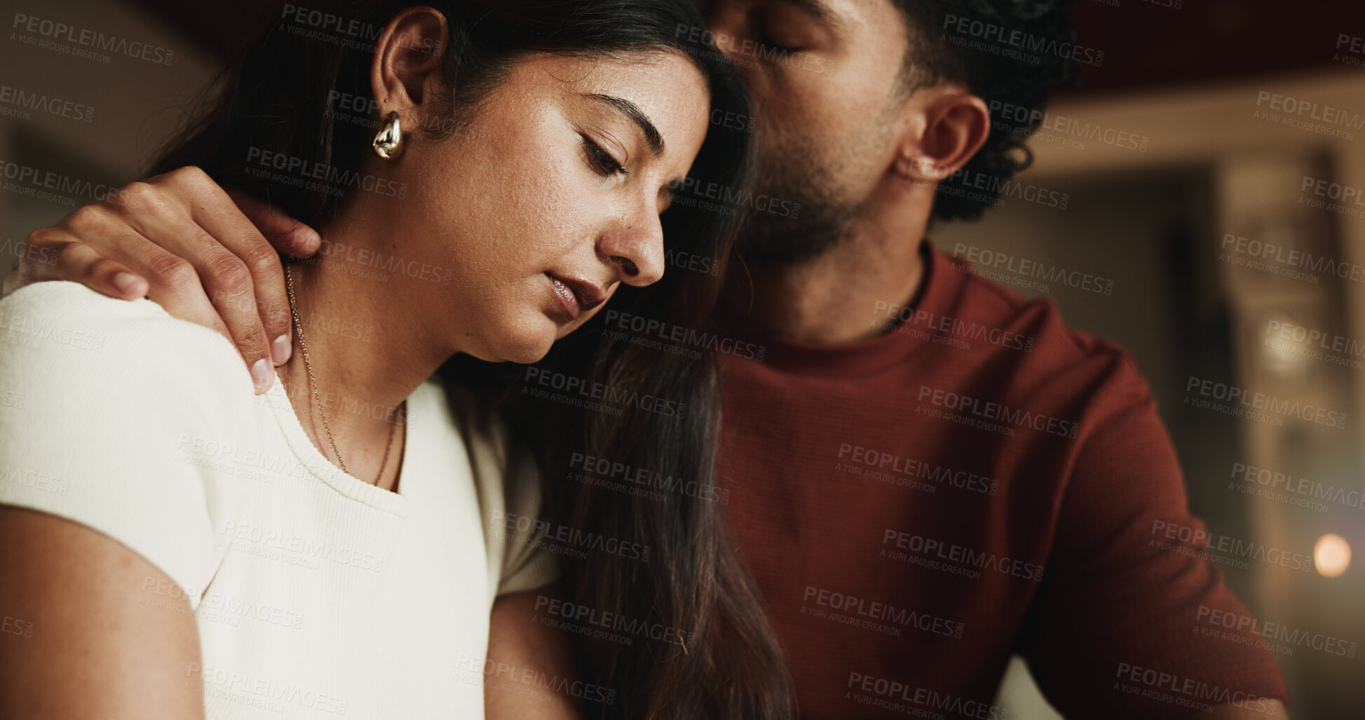 Buy stock photo Kiss, couple and sad woman with comfort in home, compassion and emotional security for understanding. Empathy, unhappy person and partner with affection for support, console and love for relationship