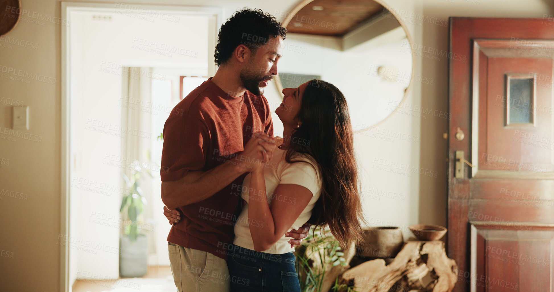 Buy stock photo Happy, couple and holding hands in home with dance, support partner and bonding together on weekend. People, smile and rhythm in house with music, loyalty and love connection for marriage commitment.