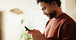Phone, relax and reading with man in home for communication, social media and contact. Virtual chat, connection and networking app with male person in apartment for news, update and online post