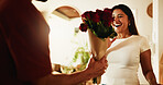 Love, couple and surprise with flowers in home for anniversary celebration, valentines day or care. Man, woman and rose bouquet in house for romantic gift, commitment and excited for floral present