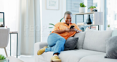 Buy stock photo Happy, black woman and relax with phone on sofa for social media, communication or texting in home. Female person, reading and news with smile or mobile smartphone on couch for online chatting app