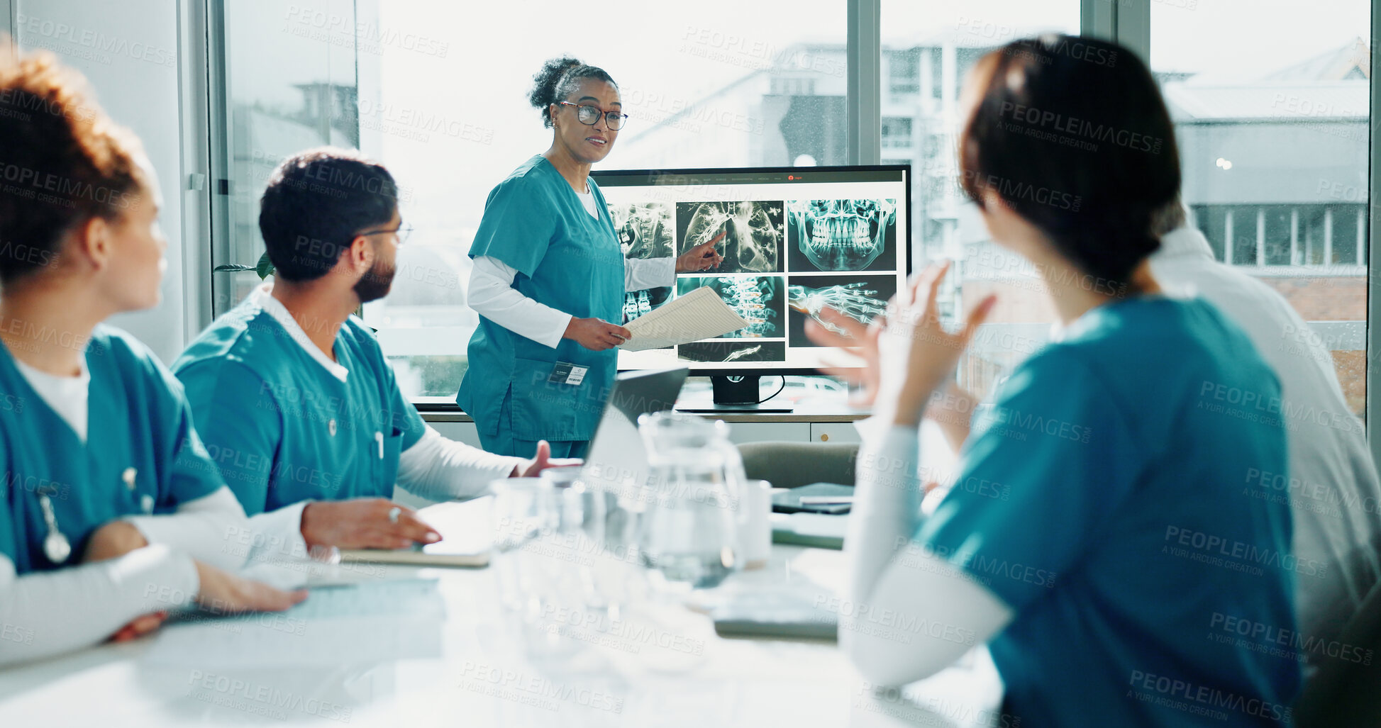 Buy stock photo Doctor, presentation and talk in hospital with screen, pointing and lung x ray for medical research. Healthcare worker, people and workshop with monitor, anatomy scan and training team for surgery.