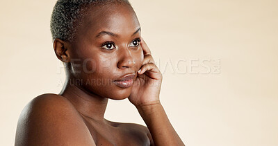 Buy stock photo Thinking, serious and black woman with skincare in studio background for vision, beauty and shine. Mockup space, female person and decision for healthy skin, cosmetic and dermatology for natural glow