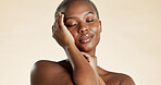 Confident, black woman and beauty with skincare in studio background for shine, cosmetics and self care. Space, female person and eyes closed with healthy skin, facial dermatology and natural glow