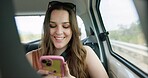 Passenger, woman and phone in car with smile, travel vacation or social media post for weekend break. Happy, person and journey in vehicle with tech, holiday adventure and check website for road trip