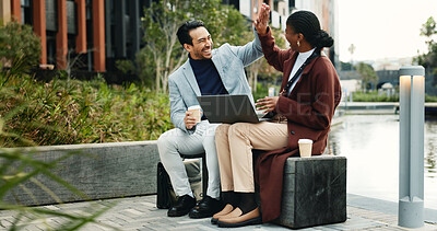 Buy stock photo Laptop, happy and business people in city with high five, remote work or success for email marketing. Team, partnership and celebration in urban town with computer, good news or advertising milestone