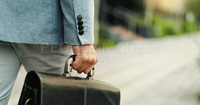 Buy stock photo Business person, hand and travel with briefcase in city, accountant and commuting to work in morning. Outdoor, financial advisor and walking with bag on street, space and employee with appointment