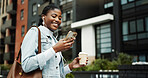 Phone, walking and black woman in city with earphones for music, internet and coffee on morning commute. Worker, travel and person with cellphone for streaming audio, podcast and playlist in town