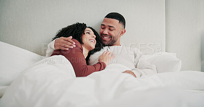 Buy stock photo Relax, cuddle and couple with smile in bedroom on weekend, romantic morning and talking for bonding. Love, support and happy people with hug for connection, care and conversation in home together