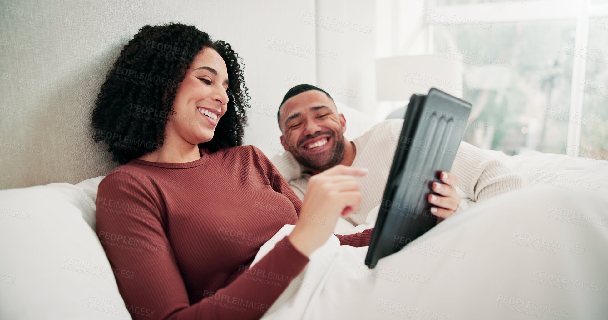 Buy stock photo Happy couple, tablet and relax in bed for movie, choice and bonding with care, blanket and break in home. Woman, man and tech with relationship, streaming or subscription with application at house