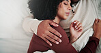 Woman, couple and sleeping in bed with cuddle, embrace and dreaming for bonding together in house. Exhausted, married people and comfortable rest in home with hug, wellness or relationship commitment