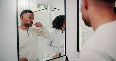 Buy stock photo Man, couple and brushing teeth in bathroom with mirror, dental hygiene and morning routine together. Married people, toothbrush and reflection in home with oral health, cleaning mouth and wellness.