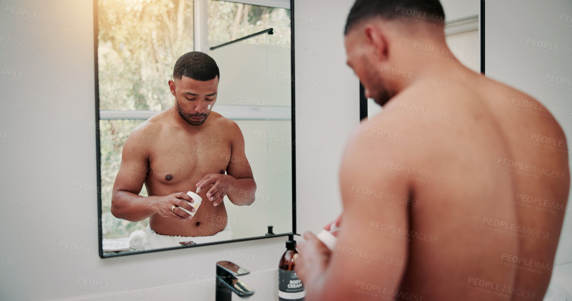 Buy stock photo Bathroom, mirror and man with cream for skincare, dermatology and self care with anti aging benefits. Morning routine, reflection and person with cosmetics for facial treatment, serious and home