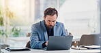 Businessman, research or reading in office with laptop, stock market report or monitor company shares. Person, online trading or risk assessment in firm with computer, investment portfolio or website