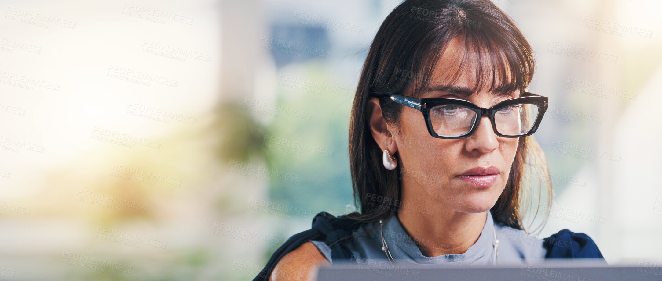 Buy stock photo Businesswoman, research or reading in office with laptop, review press release or brand management. Banner, space or mature person in agency with computer, glasses or check media for public relations