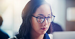 Businesswoman, research or reading in office with tech, stock trading and review investment portfolio. Person, problem solving and monitor equity with glasses, online and website for capital funding.