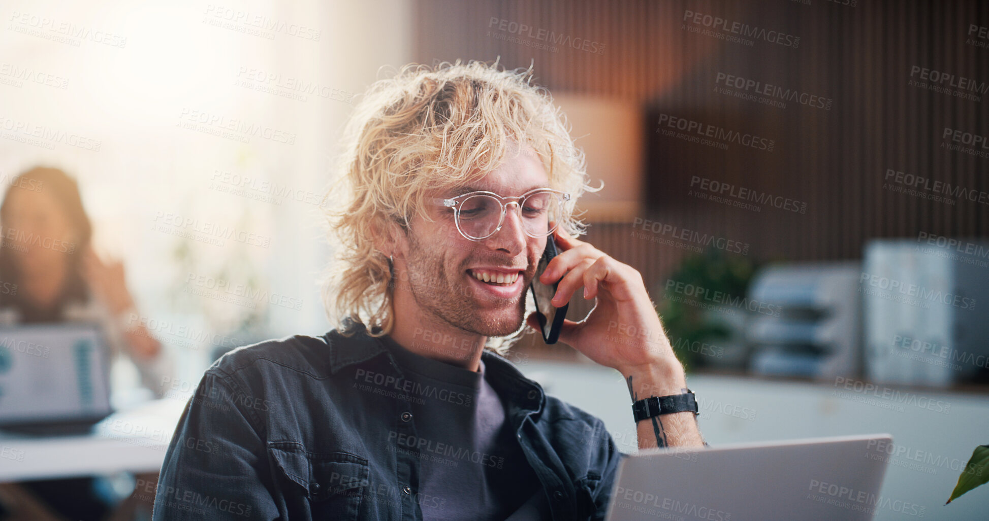 Buy stock photo Creative, phone call and happy man with laptop in office, social media talent agent or communication. Business, influencer marketing and person with mobile for discussion, smile or ad campaign on web