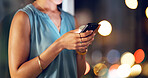 Night, woman and hands in office with phone, text message and check deadline for marketing project. Late, bokeh and person in business with tech, mobile app or typing update for advertising schedule.