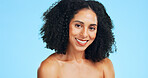 Portrait, smile and woman in studio, cosmetics and dermatology on blue background. Happy, aesthetic and person with wellness, shine and beauty for healthy skin, glow and grooming with skincare