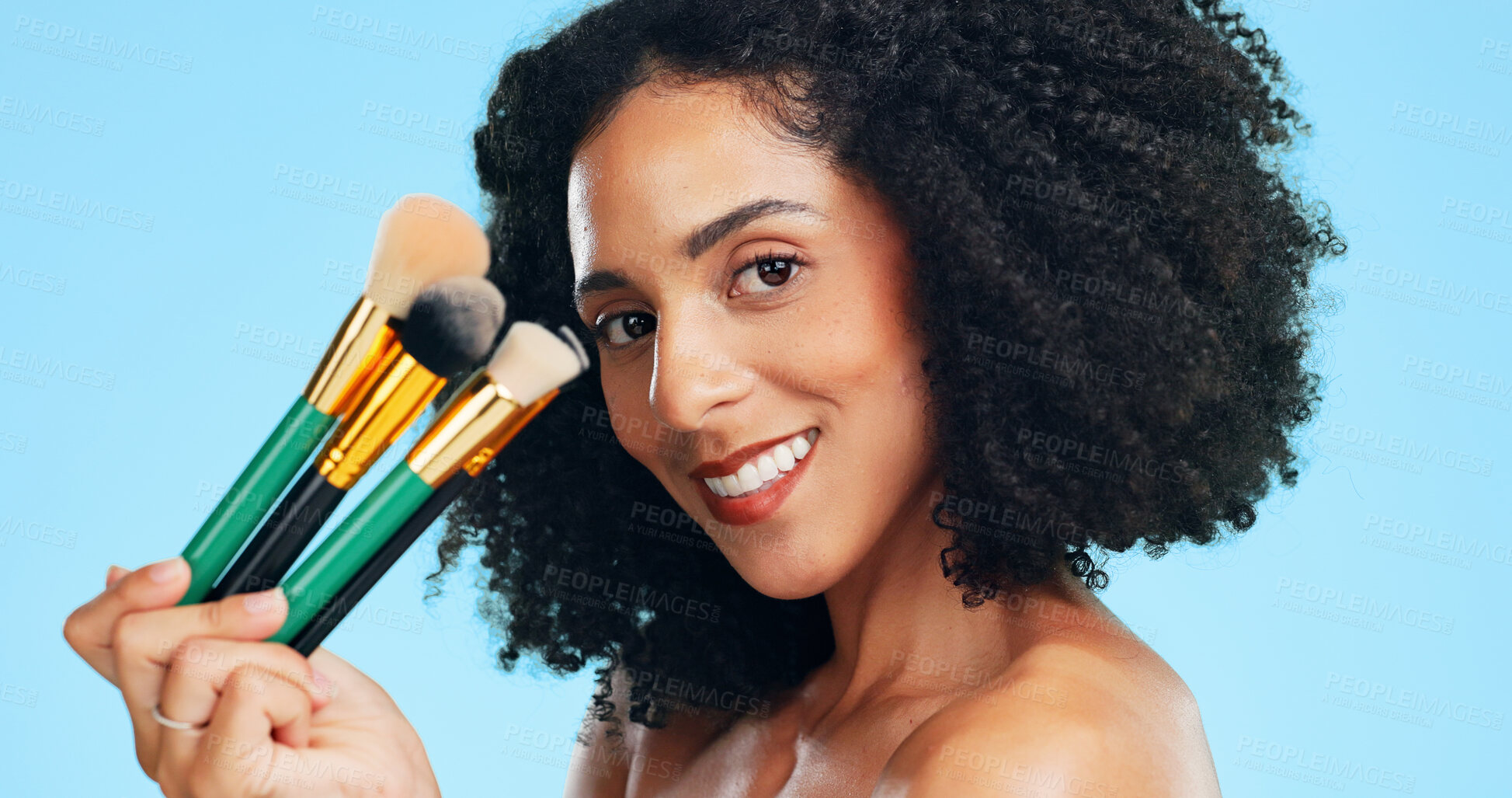 Buy stock photo Makeup, brushes and portrait of woman in studio for cosmetics, application and foundation. Cosmetology, happy and person with tools for blush, beauty products and salon aesthetic on blue background