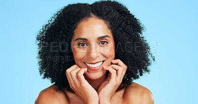 Buy stock photo Skincare, happy or woman in studio with portrait, shine or soft touch in facial care. Wellness, smile or female person on blue background with confidence, dermatology or glow with for smooth skin.